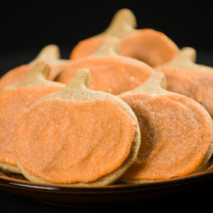 Pumpkin shaped cookies with frosting